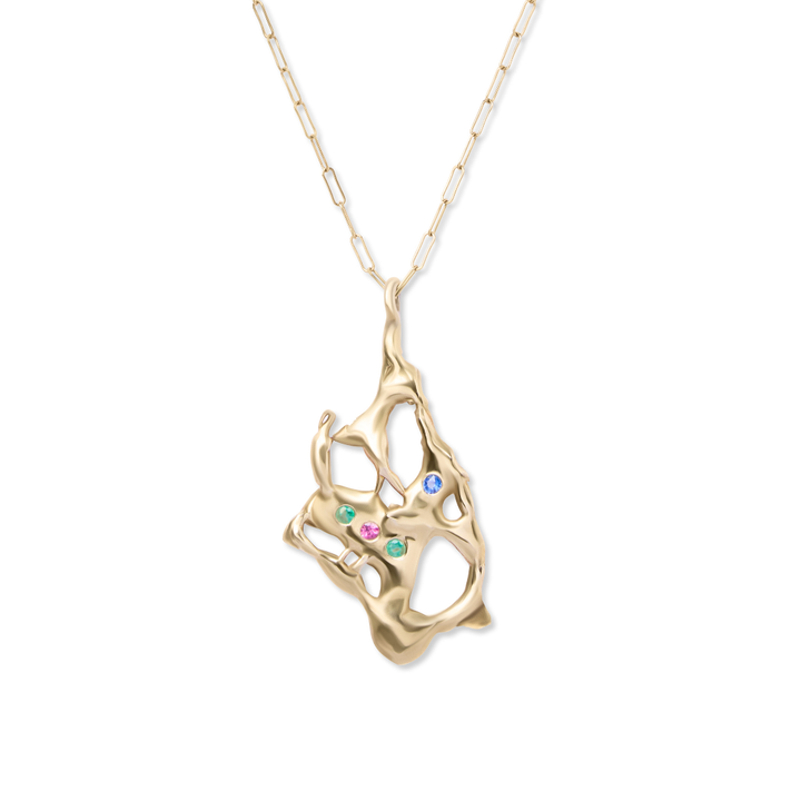 The Molten Pendant with Gemstones by Madeleine Sculptural Jewellery features a unique gold pendant with organic openwork shapes and green, blue, and pink gemstones on a delicate, elongated chain. This handmade piece highlights true artistry.