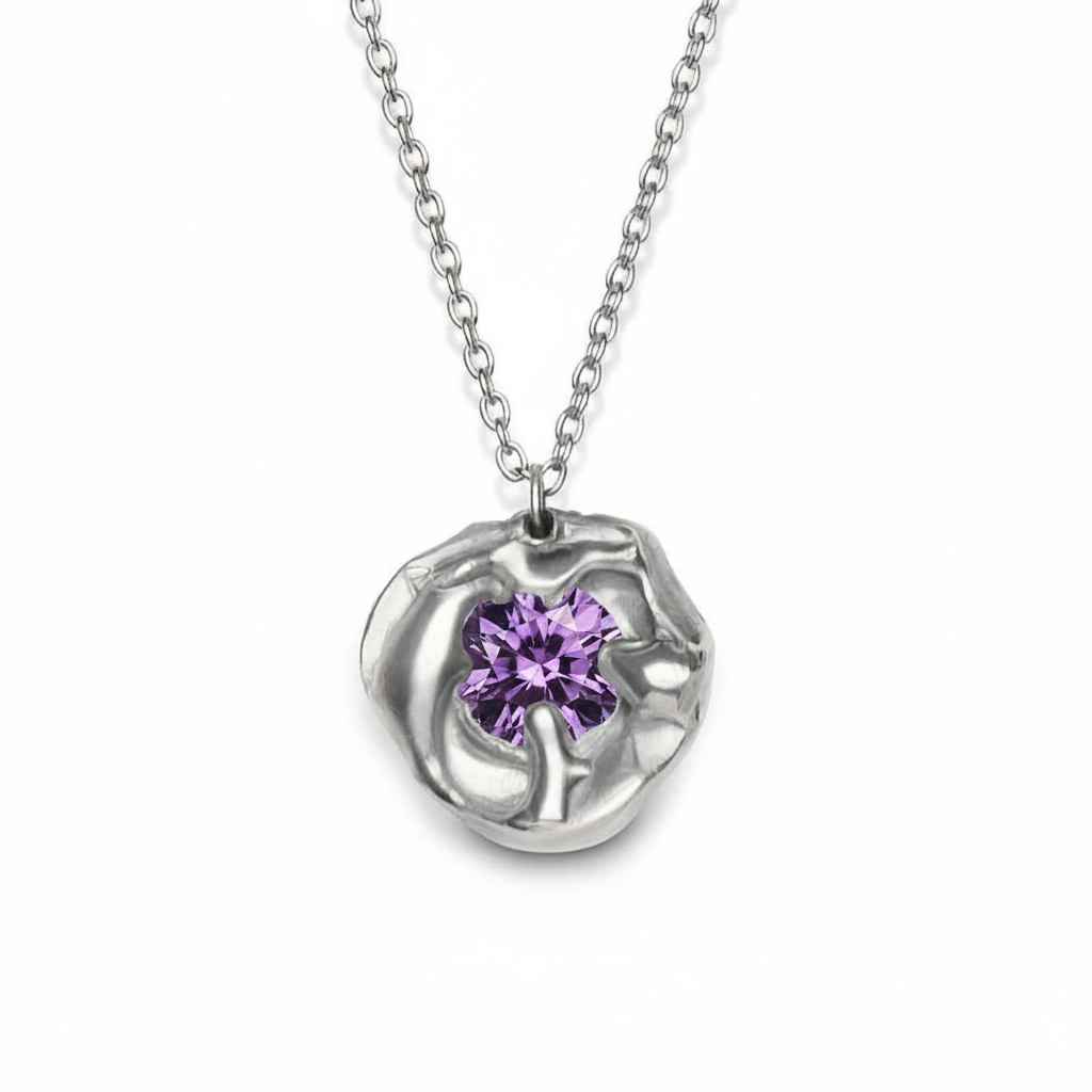 The Molten Necklace with Moissanite by Madeleine Sculptural Jewellery features an abstract silver setting with a brilliant round moissanite at its center, suspended on a delicate chain—a unique piece of handmade jewellery.