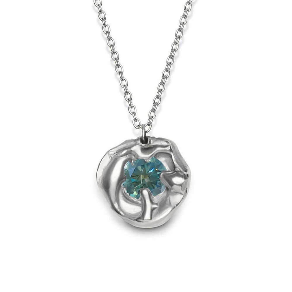 The Molten Necklace with Moissanite by Madeleine Sculptural Jewellery is a handmade piece featuring a silver pendant with an abstract flower design and a central round moissanite gemstone.