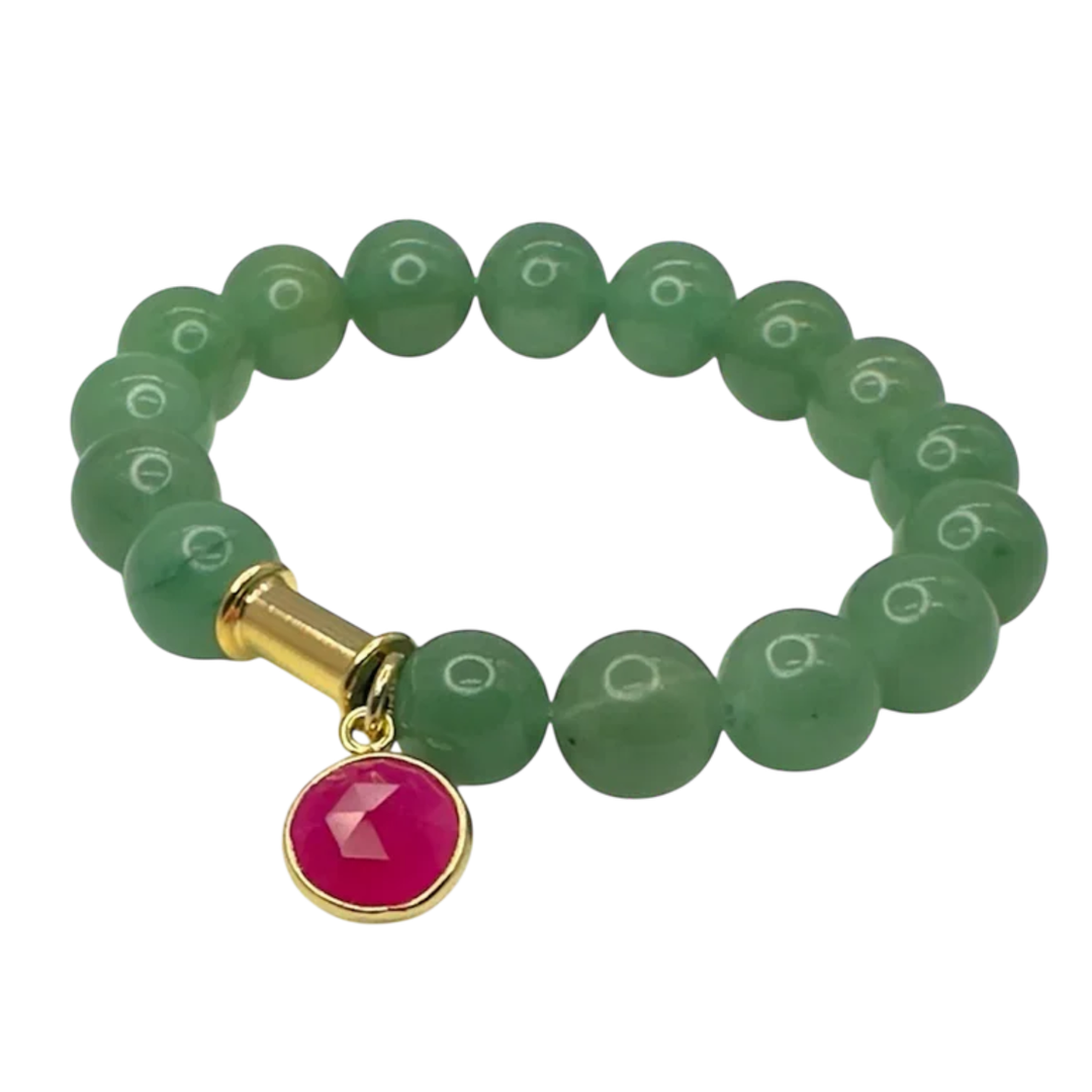 The Aria V Soulstone Moss Agate and Pink Chalcedony Bracelet features green round beads, a gold cylindrical accent, and a red circular charm with a gold rim. Handmade in Dublin and shown on a white background.