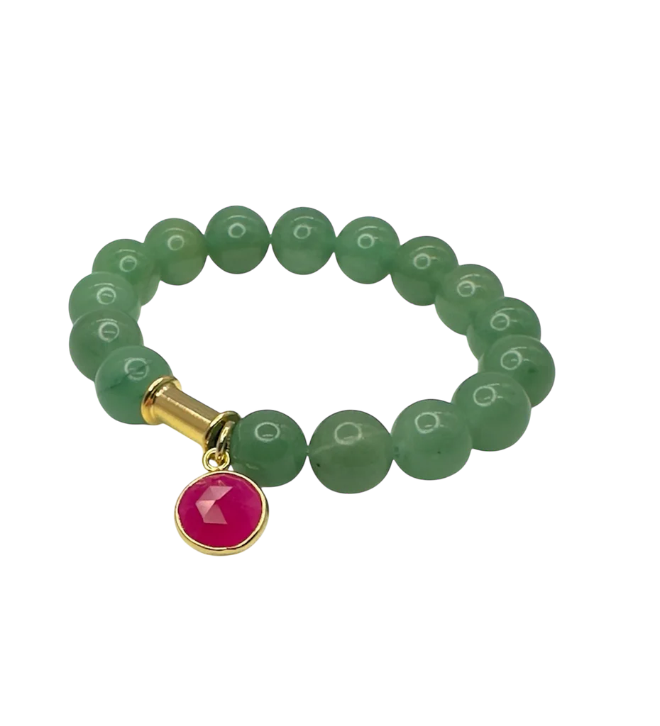 The Aria V Soulstone Moss Agate and Pink Chalcedony Bracelet features green round beads, a gold cylindrical accent, and a red circular charm with a gold rim. Handmade in Dublin and shown on a white background.