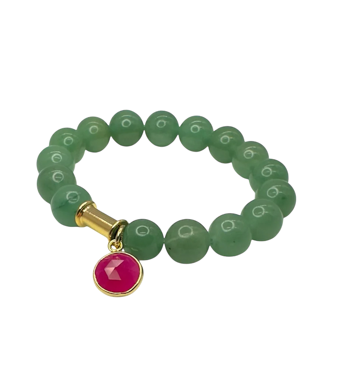 The Aria V Soulstone Moss Agate and Pink Chalcedony Bracelet features green round beads, a gold cylindrical accent, and a red circular charm with a gold rim. Handmade in Dublin and shown on a white background.