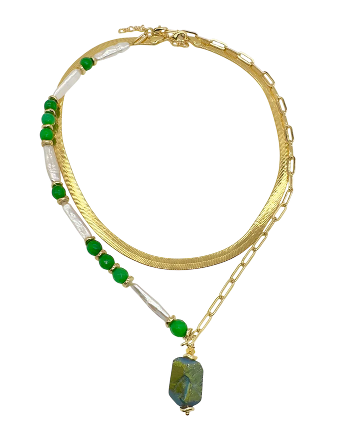 The Muse Green Necklace by Aria V features dual gold-plated chains—one flat, one linked—adorned with green beads, white pearls, and a green rectangular stone pendant, offering elegant baroque pearl necklace style.