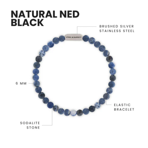 The Steel and Barnett Natural Ned 6mm Round Gemstone Bracelet features matte sodalite beads and a brushed silver stainless steel accent, combining earthy tones with modern design. Labeled features highlight the stones and metal accent.