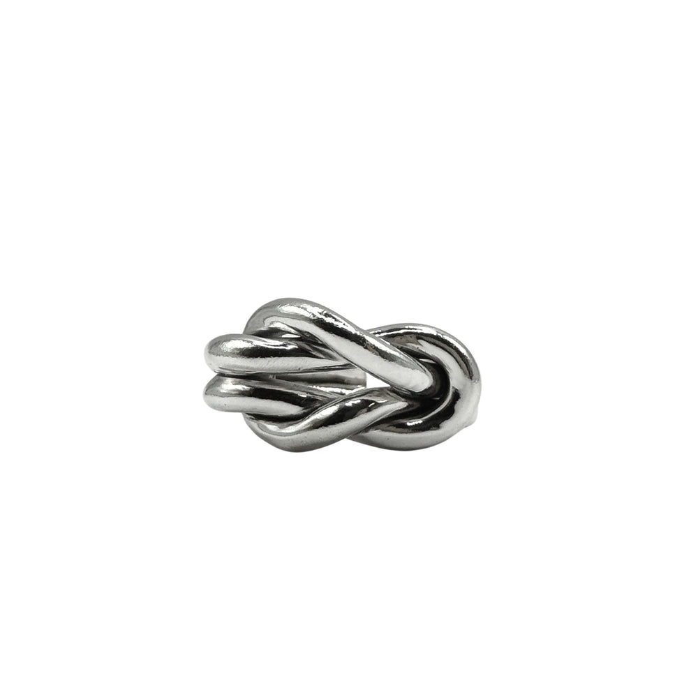 The Nautical Knot Ring by Inó Jewellery, a chunky, handcrafted silver piece shaped like intertwined loops, is displayed against a plain white background.