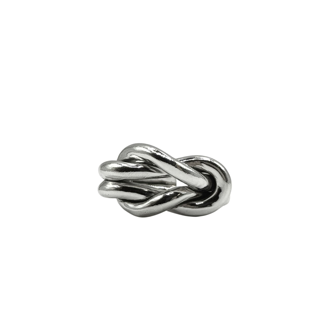 The Nautical Knot Ring by Inó Jewellery, a chunky, handcrafted silver piece shaped like intertwined loops, is displayed against a plain white background.