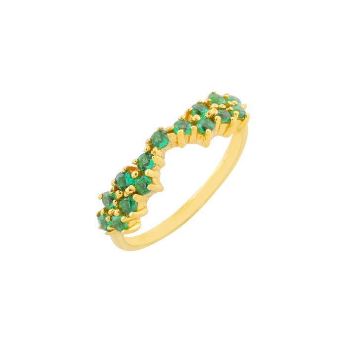 The Octavia Ring by Shyla is a gold piece featuring a semi-circle design adorned with tiny green crystals, likely emeralds, arranged in a staggered pattern along the top half of the 22 carat on sterling silver band. The ring has a delicate and elegant appearance.