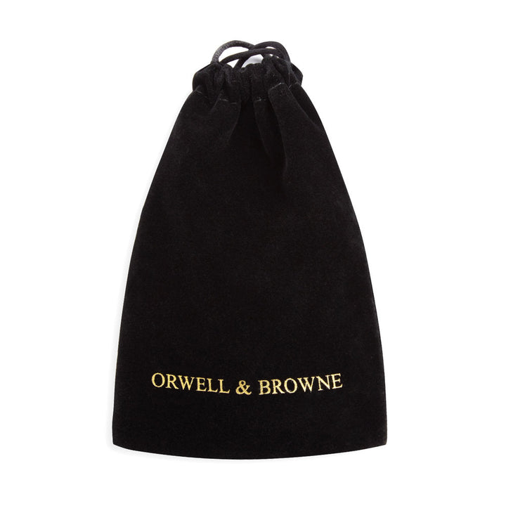 A black drawstring pouch with the words "ORWELL & BROWNE" written in gold lettering at the bottom center, perfect for storing your Speckled Burgundy Tweed Cufflinks.