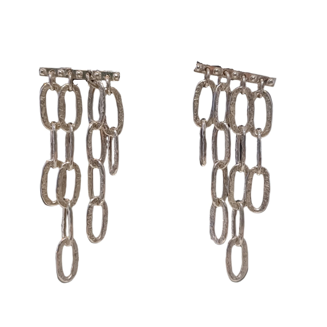 K.And’s Oval Chain Link Dangle Earrings in Silver or Oxidised feature three rows of textured, oval-shaped links cascading from a horizontal bar for a bold, modern look.