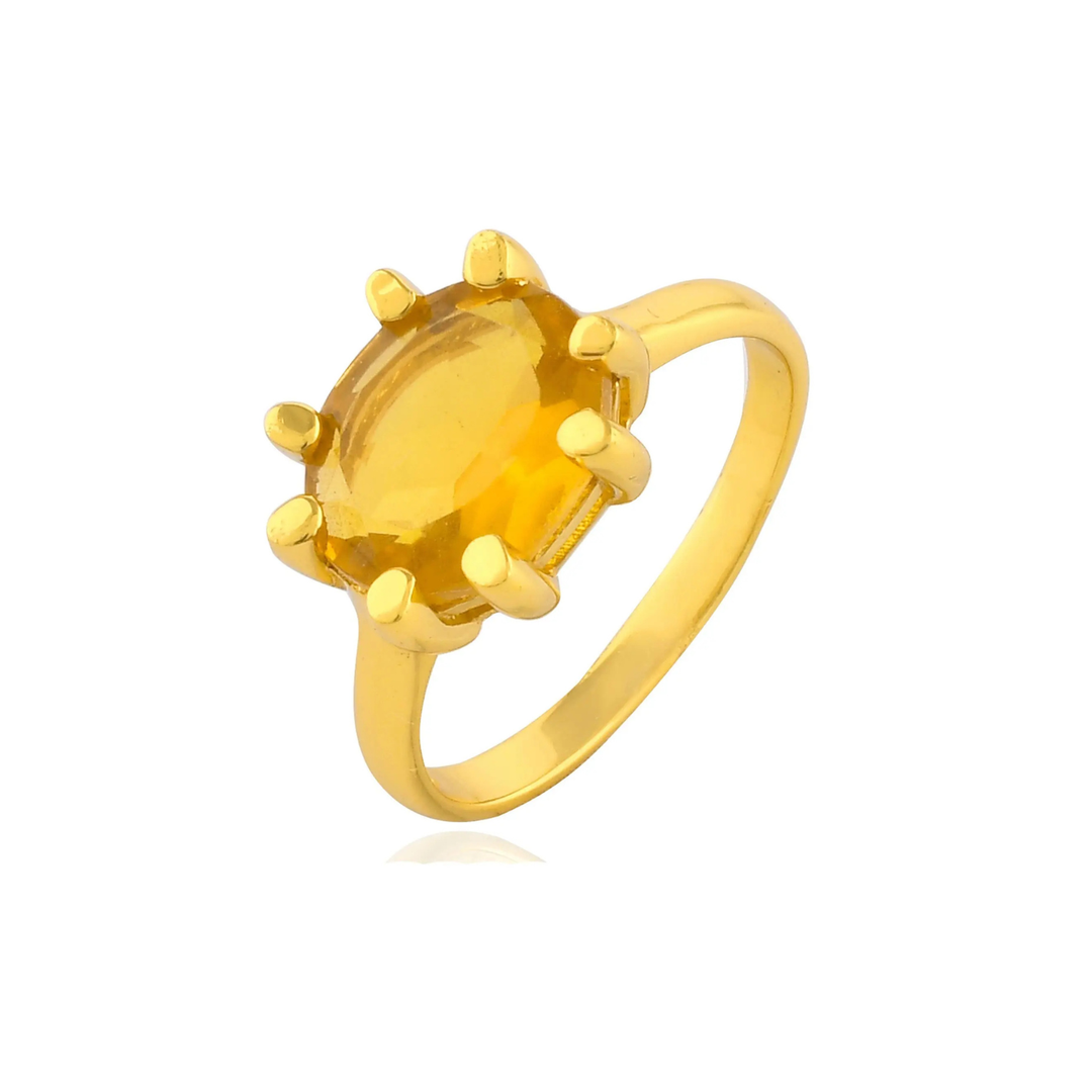The Shyla Oval Claw Ring in various colours is a gold-on-sterling silver statement piece with an oval gemstone secured by eight prongs, shown on a white background.