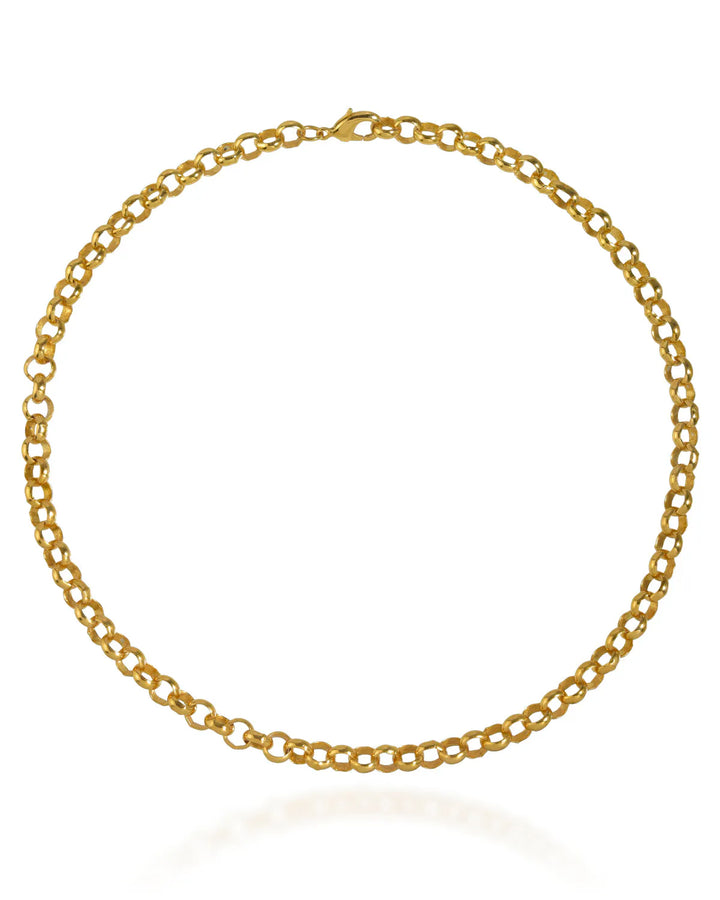 A statement gold necklace featuring interlocking circular links forms a full circle. The subtly visible clasp at the top catches light, casting a slight shadow on a white background. This chunky 18" belcher chain design, named Palermo by Shyla, is simple yet elegant, truly timeless in its appeal.