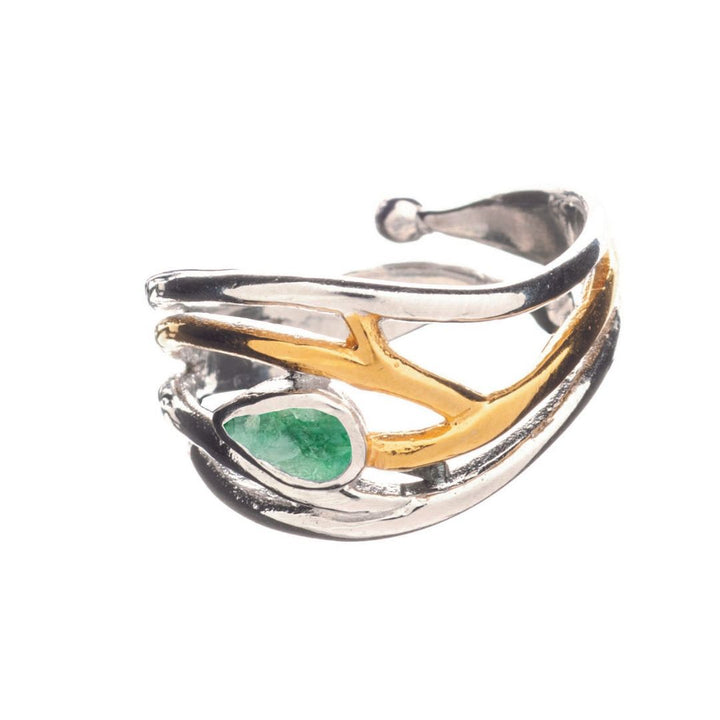 Introducing the Gallardo & Blaine Designs' Peacock Ring in various gemstones: a stunning silver and gold vermeil piece featuring an intertwined branch design. Its adjustable band, adorned with a prominent green stone, embodies elegance and timeless style.