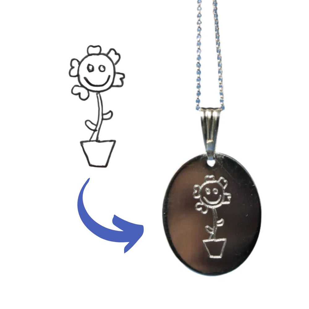 Sterling silver necklace with a flat oval pendant engraved with a flower in a pot which was drawn by a child.