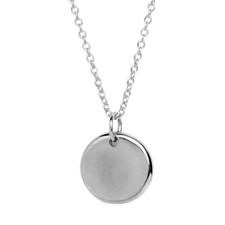 The Collective Dublin’s Personalised Large Round Organic Droplet Necklace features a simple, polished silver charm pendant on a silver chain, displayed against a white background. The pendant is plain, round, and unadorned.