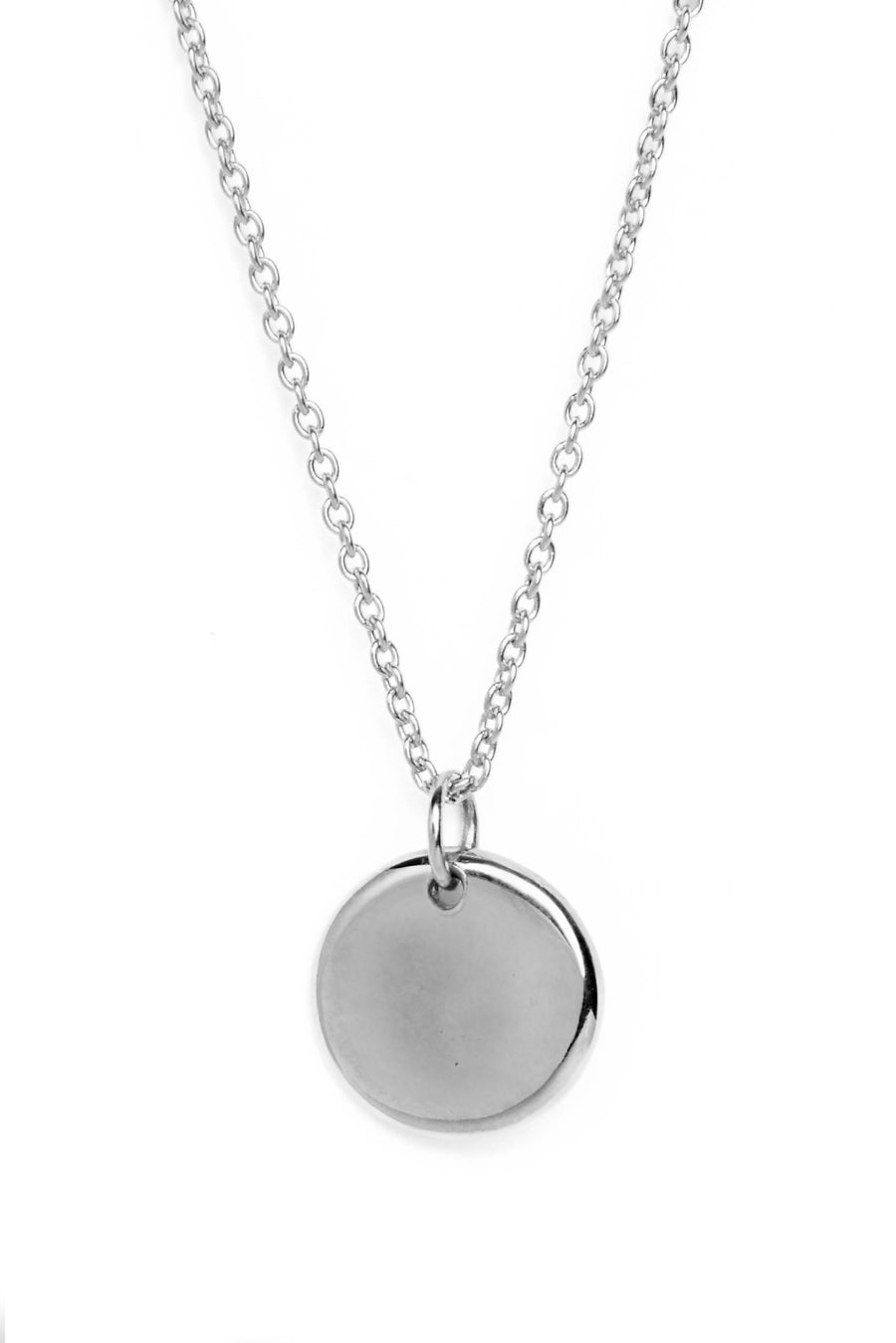 A sterling silver necklace with a round organic shaped circle pendant measuring 15mm in diameter which has a subtle indent in the centre.