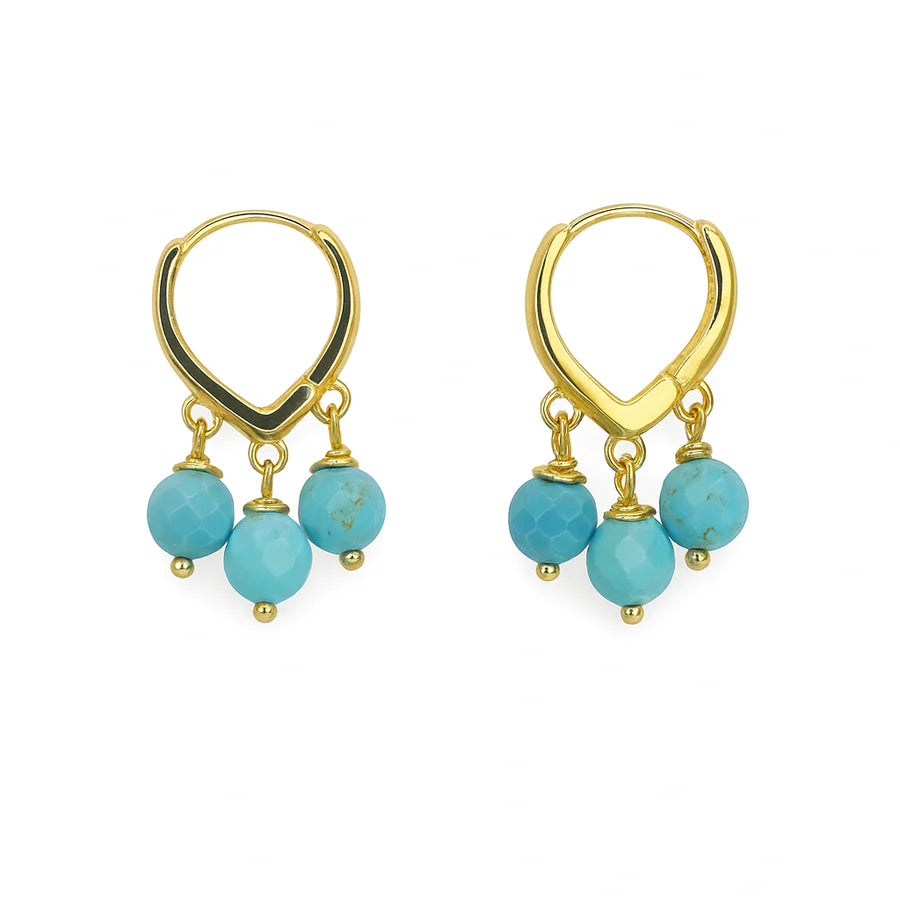 Polly Earrings by Aria V: Gold-plated hoops with three dangling turquoise beads on each, showcased on a white background. Handmade in Ireland, these vibrant earrings add a pop of color to any outfit.