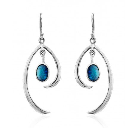 A pair of Primrose Earrings in various gemstones from Gallardo & Blaine Designs, in sterling silver with an artistic, curved design, each featuring an oval-shaped blue gemstone. The gemstones are suspended in the middle of the curved silver elements, providing a touch of minimalist elegance and color to the sleek, contemporary style.