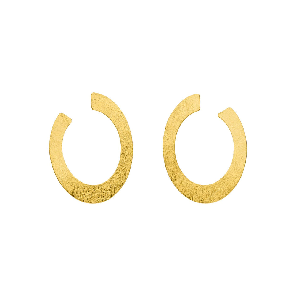 The Tezer Open Oval Earrings are gold-plated with a textured finish, featuring an open oval shape with a small gap that forms an almost complete circle. Displayed on a white background.