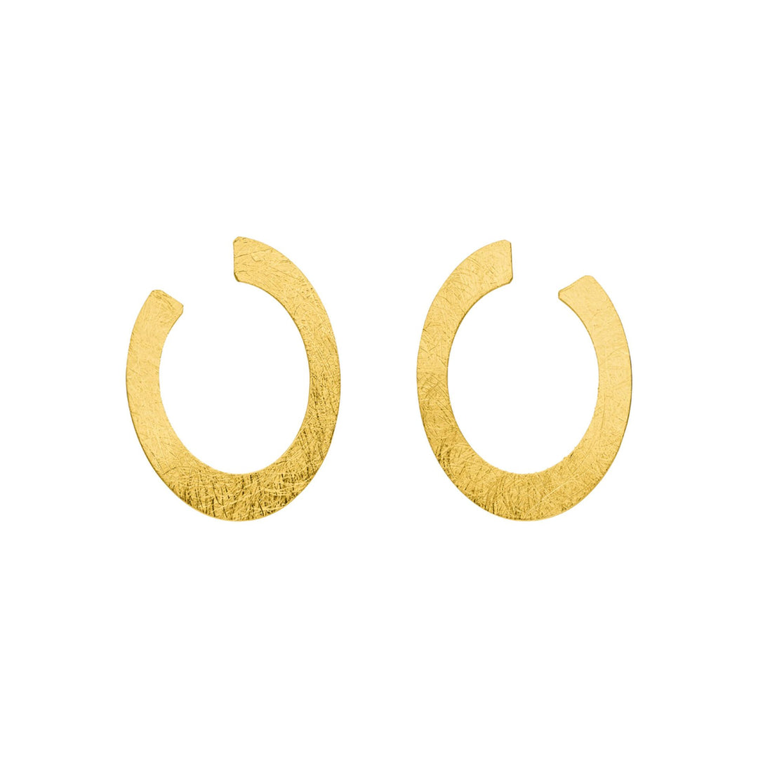 The Tezer Open Oval Earrings are gold-plated with a textured finish, featuring an open oval shape with a small gap that forms an almost complete circle. Displayed on a white background.