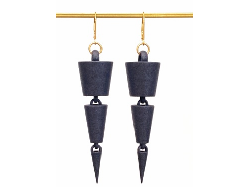 Black cone shaped segmented drop earrings with gold ear hooks shown on a gold bar on a white background.