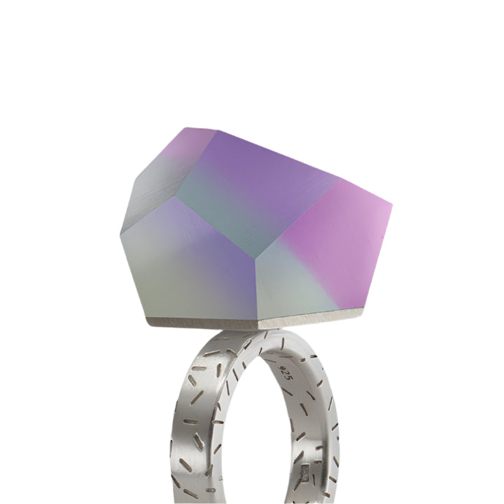 The Fruit Bijoux Ring Top Unicorn by Fruit Bijoux is a modern, interchangeable sterling silver ring top with a large, faceted geometric stone in pastel purple, pink, and green for versatile styling.