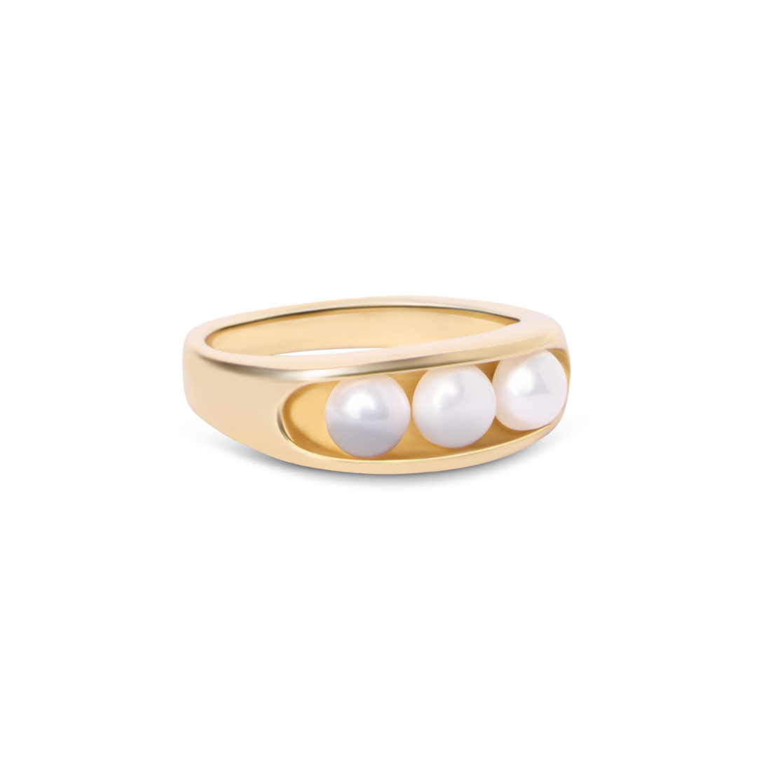 The Sierra Pearl Ring by Gallardo & Blaine Designs features a gold plated, wide smooth band adorned with three round white pearls set in a recessed row across the top.