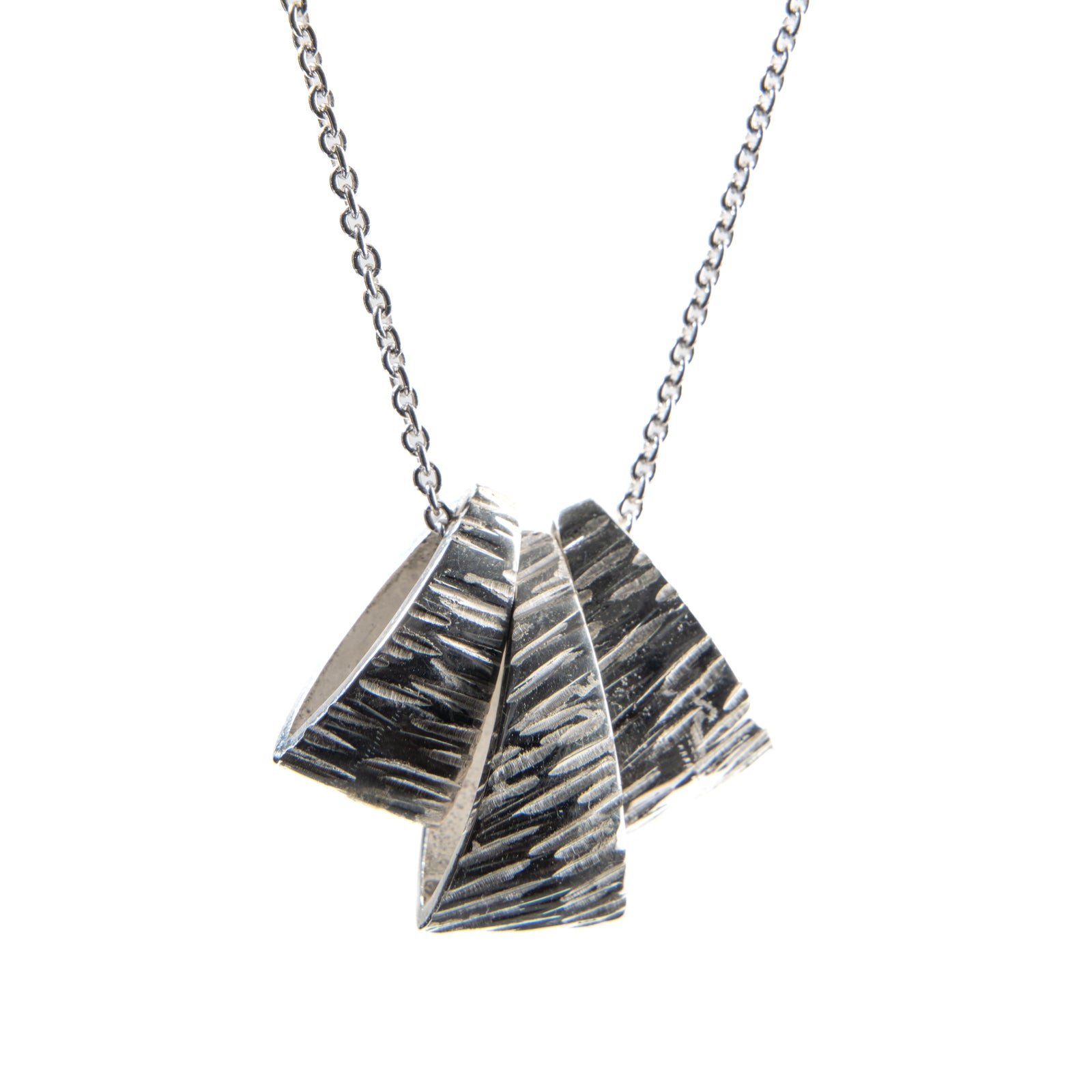 Silver three piece pendant with texture on an adjustable 16 to 18 inch silver chain