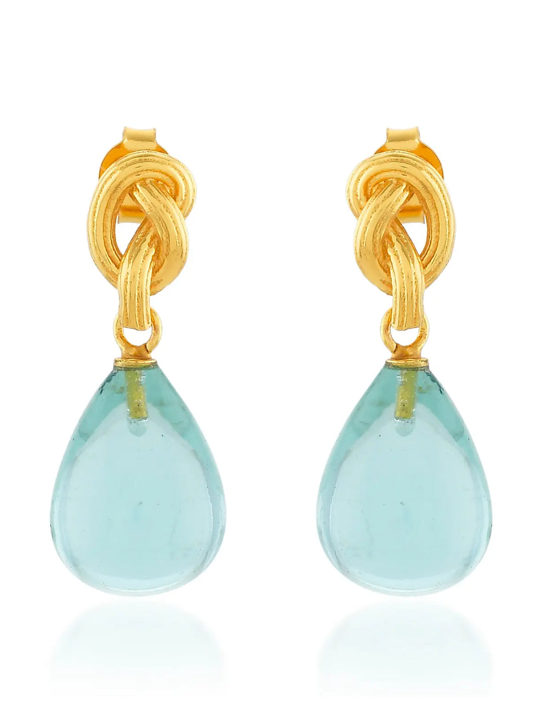 The Synthea Earrings by Shyla feature gold knots with teardrop light blue gemstones, shown on a white background. These hypoallergenic earrings offer stylish, everyday elegance and are perfect for sensitive ears. Available in various colours.
