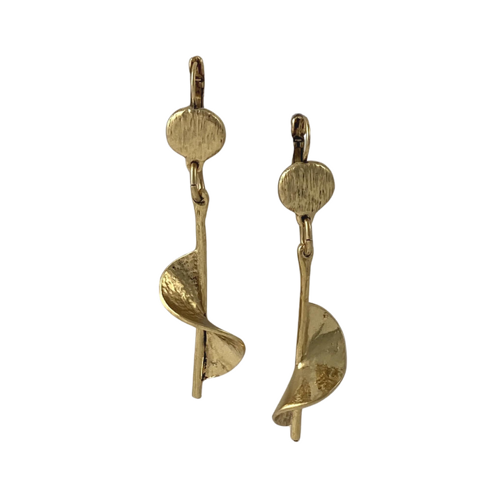 A pair of Sara Gold Plated Pewter Earrings from J. Boetsch Creations featuring a circular stud at the top with a long, vertical post that twists into a spiral shape towards the bottom. The earrings have a shiny, polished finish and an elegant, modern design.