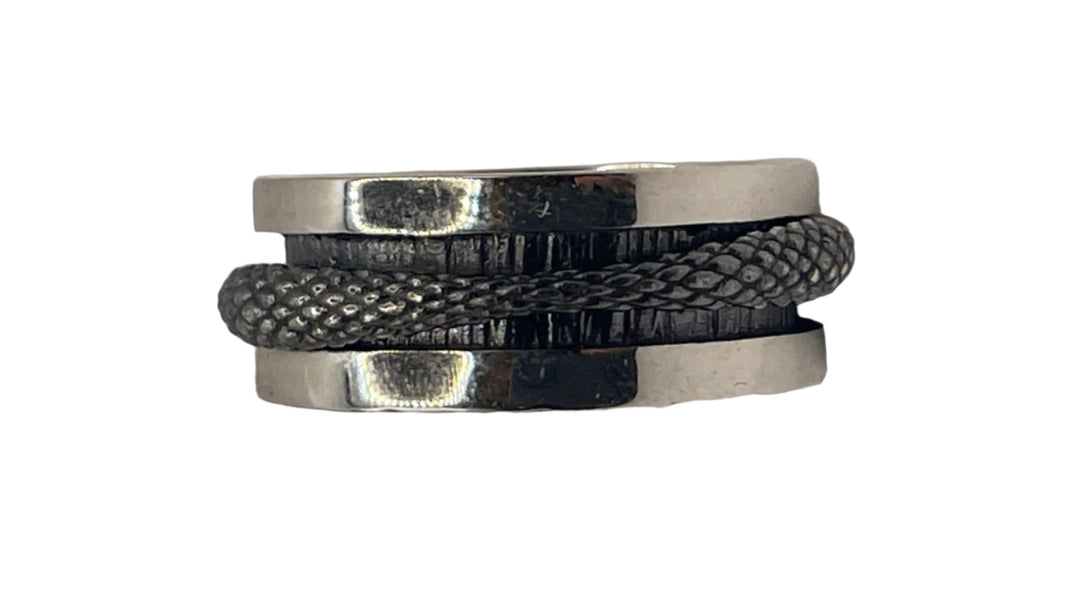 The K.And Scaled Texture Silver Spinner Ring features a black and silver design with a raised, snake-like pattern wrapping around its center, displayed against a white background.