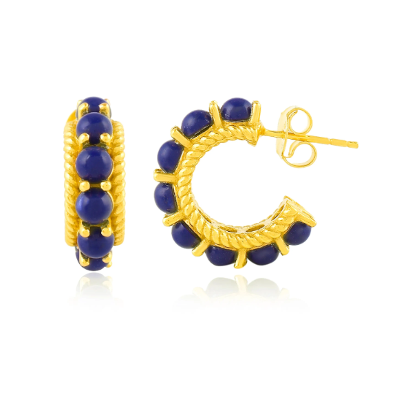 The Rosalia Hoop Earring by Shyla features gold hoops adorned with round blue stones and a rope-textured design along the edges. These elegant everyday earrings are displayed with one front-facing and the other shown from the side.