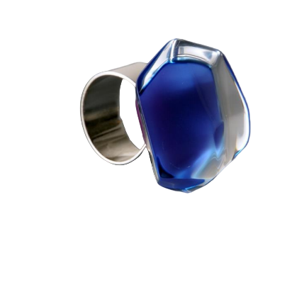The Acrylic Dark Blue Ring by MX.design features a large faceted translucent blue acrylic gemstone and an adjustable sterling silver band, shown against a white background for a striking statement look.