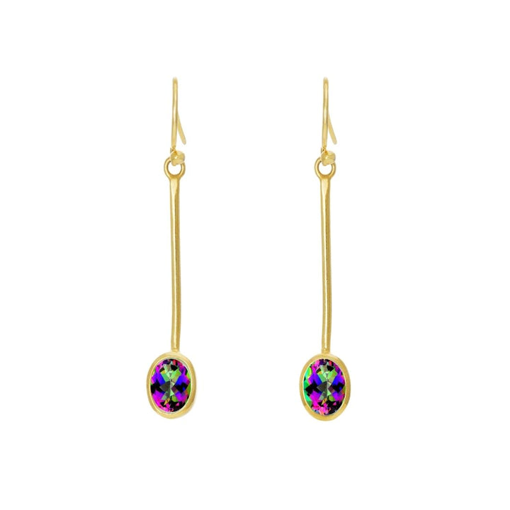 Gallardo & Blaine Designs' Sequola Earrings feature gold drop earrings with long, thin hooks and iridescent oval gemstones displaying vibrant green, purple, and blue hues. These earrings add a colorful accent to their sleek design, offering timeless charm beyond trends.