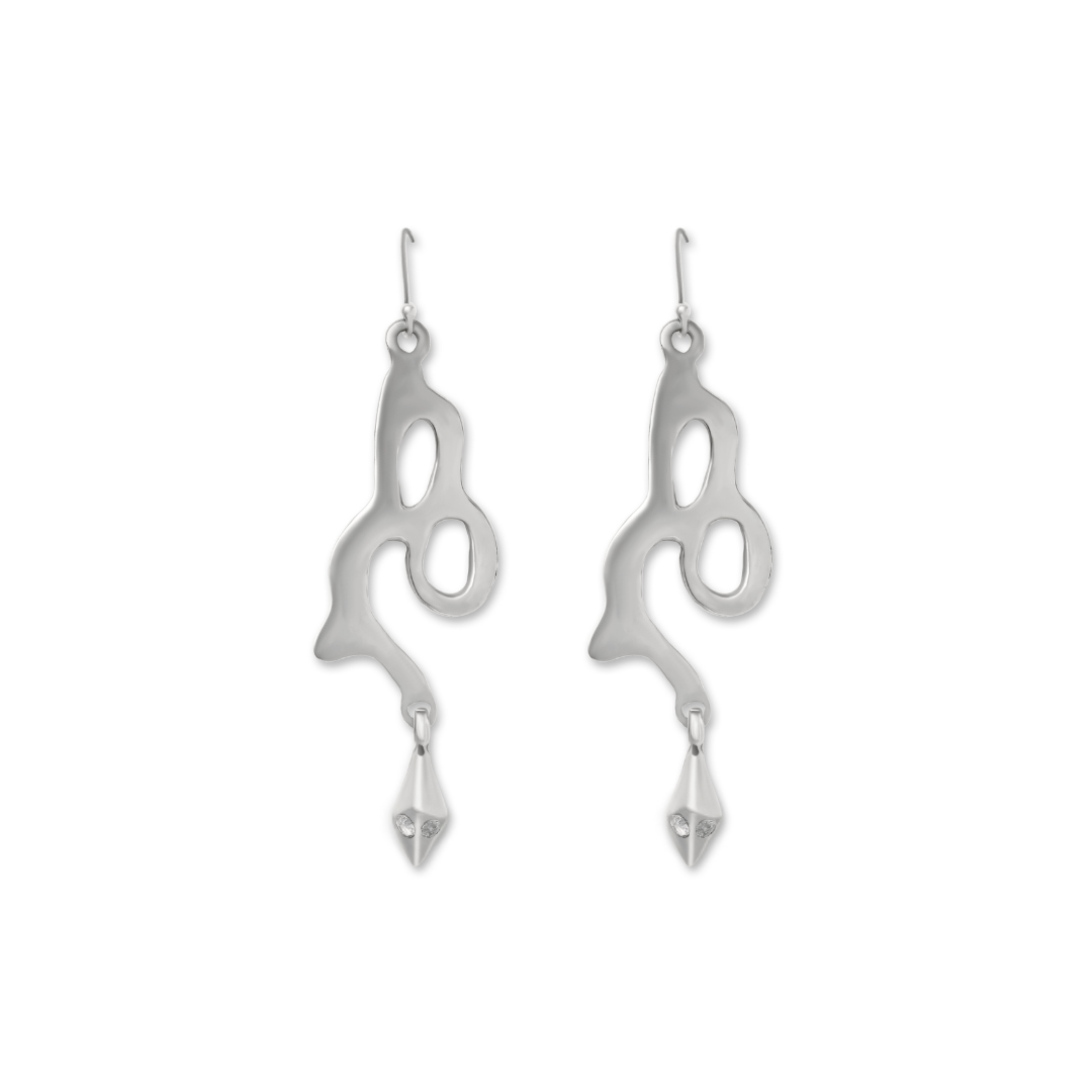 The Serpent Earrings by Madeleine Sculptural Jewellery are abstract silver dangle earrings with fluid, organic shapes and geometric drops, featuring hook fastenings for easy, sustainable style.