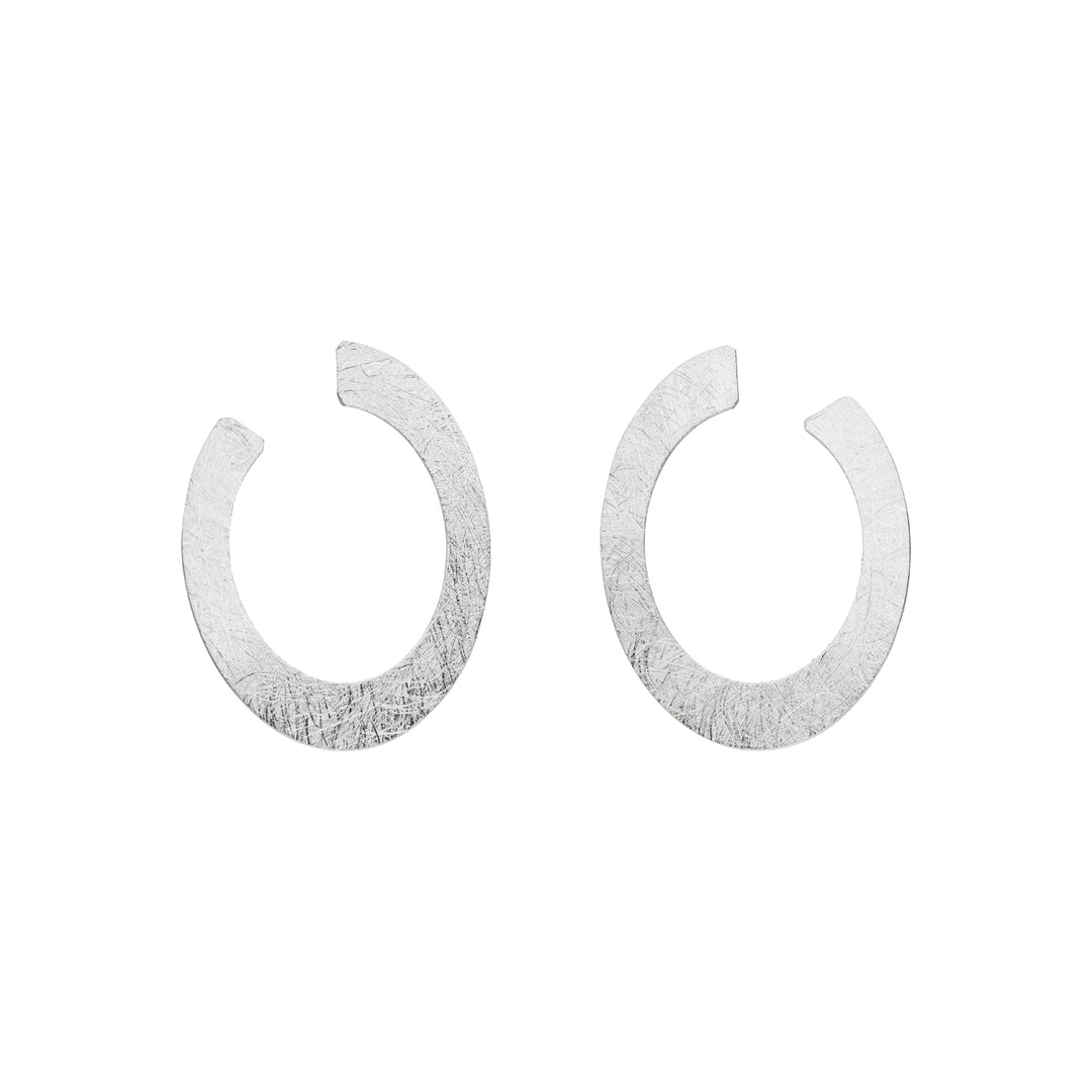 Tezer Silver Open Oval Earrings feature a textured, flat, oval shape with a small gap at the top, displayed on a white background.