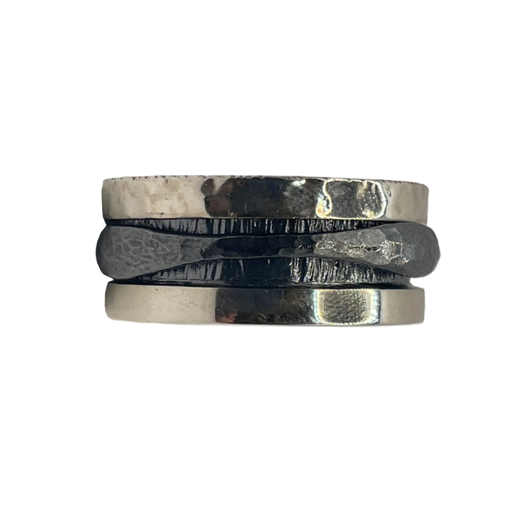 The K.And Silver & Oxidised Single Spinner Ring features a sterling silver and black design with shiny and oxidized finishes, offering subtle stress relief through its smooth spinning action.