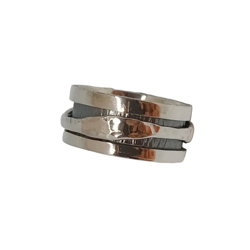 The K.And Silver Spinner Ring with Textured Finish features three wide, uneven bands stacked for a modern, layered look. Its shiny surface stands out against a white background.