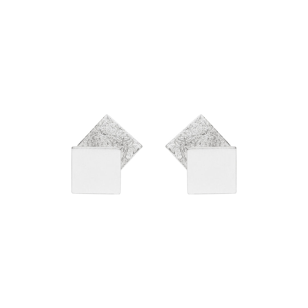 Two overlapping square silver studs. Square behind has a satin textured finish. 