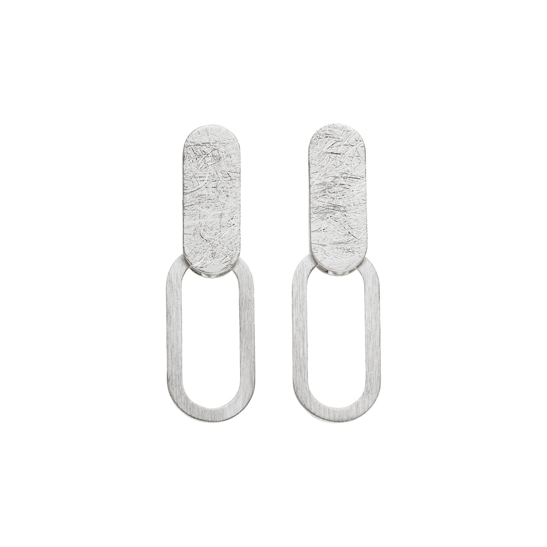 Tezer's Silver Paperclip Stud Earrings feature minimalist sterling silver, with a textured oval stud and smooth elongated open oval loop for a modern look.