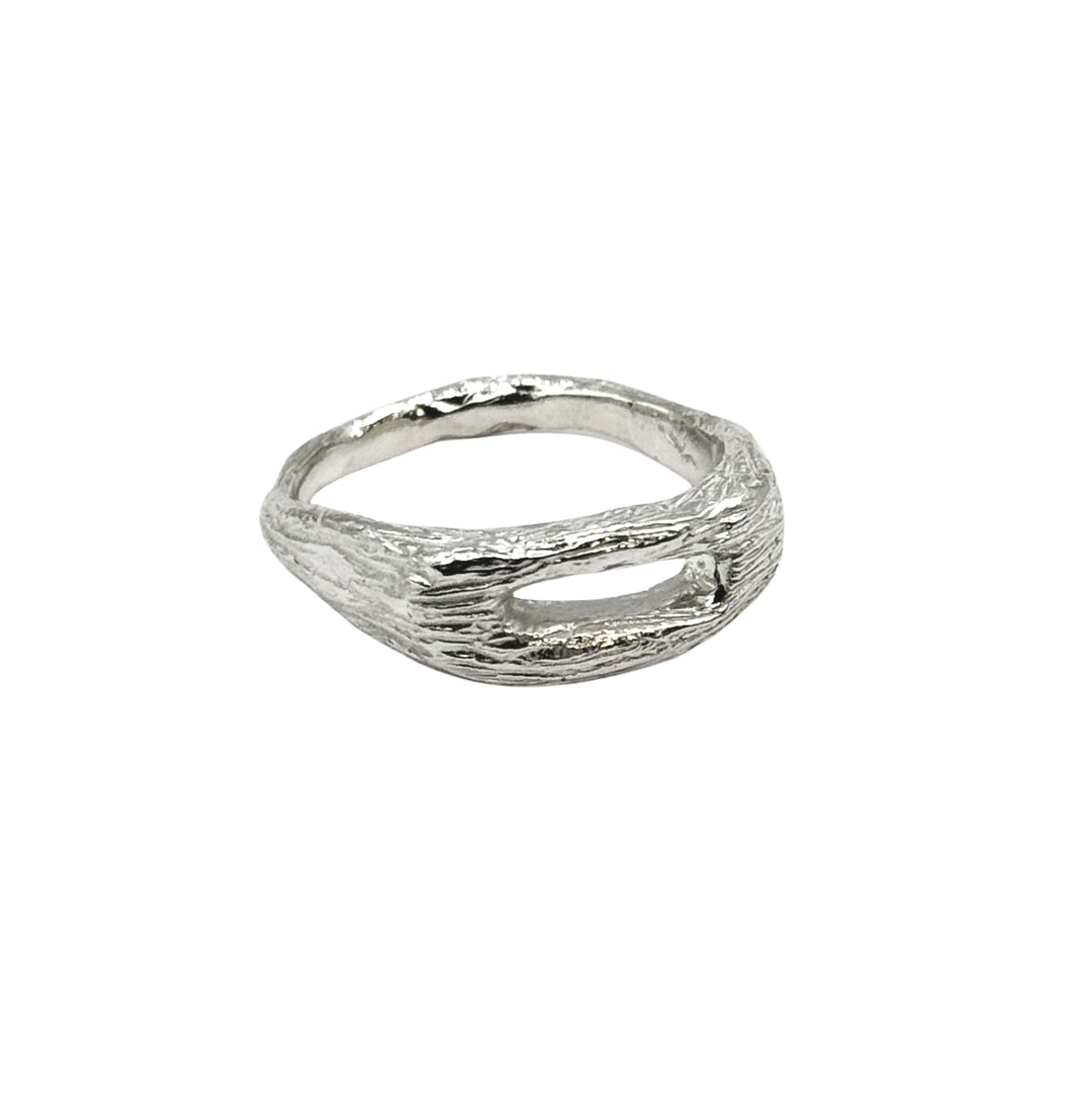 The Souvenir Silver Ring by Inó Jewellery is a handcrafted sterling silver piece with a textured, organic tree bark design and an open gap, giving it a unique, rustic look that highlights its natural, handmade charm.