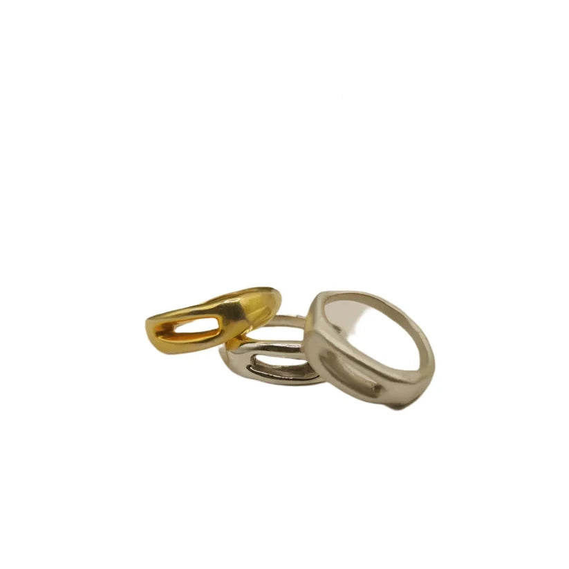 The Inó Jewellery Souvenir Silver Ring is shown on a white background, featuring a bold, open oval shape and modern geometric design in hand-crafted sterling silver and gold finishes.