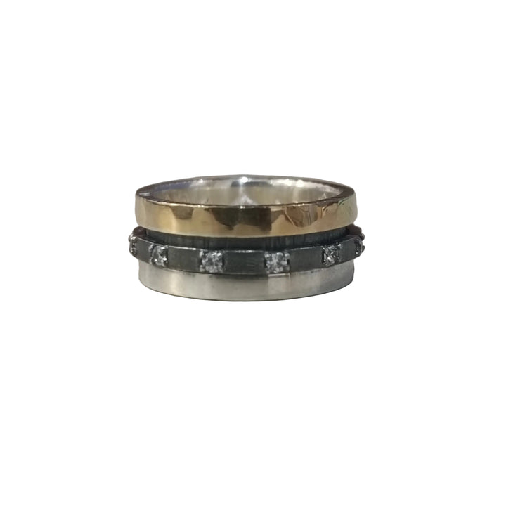 The K.And Spinner Ring features a textured 18ct yellow gold band atop a sterling silver ring with square-cut cubic zirconia and a dark accent strip.