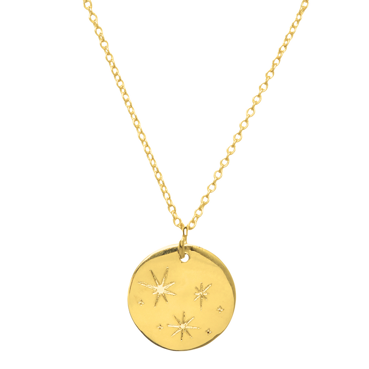 The Symbol Necklace in 9k Gold by Personalised Charms showcases a round, engraved pendant with star designs on a delicate chain—a beautiful personalized jewelry piece for any occasion.