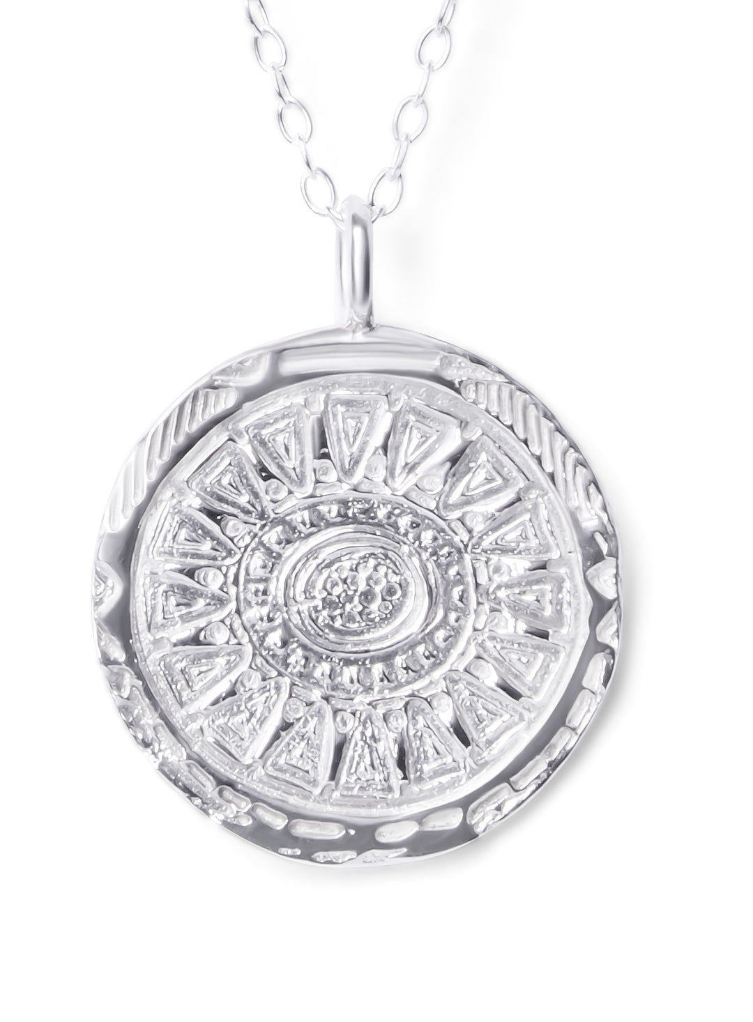 The Sunbeam Silver Pendant by Ava Jane Jewellery features a round, textured medallion with intricate sunburst patterns on a delicate sterling silver chain—a handmade, elegant gift for her.