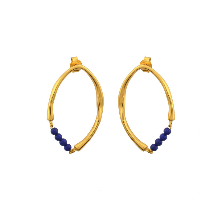 A pair of Shyla Thiva Earrings featuring an asymmetrical, twisted design in 22 carat gold. Each elegant earring has a row of small, round blue beads at the bottom. The earrings have a shiny finish and are displayed on a white background.