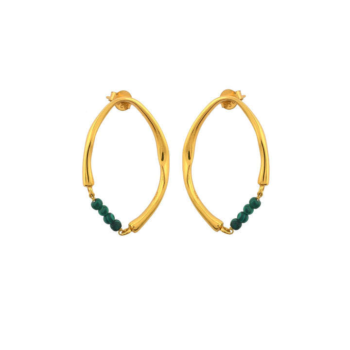 The Shyla Thiva Earrings are a pair of gold-tone, hoop earrings with an organic, twisted design. Each elegant earring features a string of small, green beads at the bottom center, crafted meticulously in 22 carat gold.