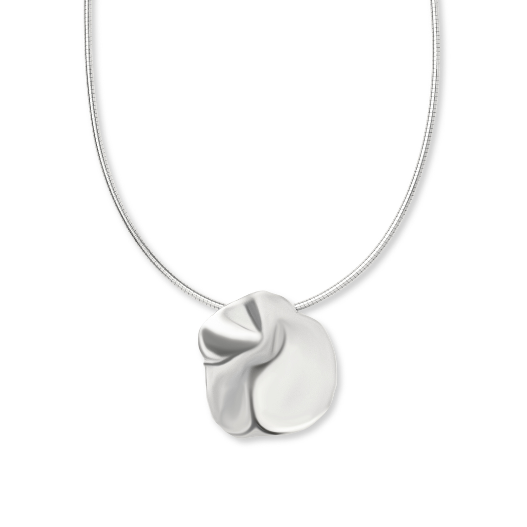 The Tide Necklace by Madeleine Sculptural Jewellery features a unique, abstract silver pendant with smooth, folded curves on a thin chain—an elegant, handmade piece showcased against a plain white background.