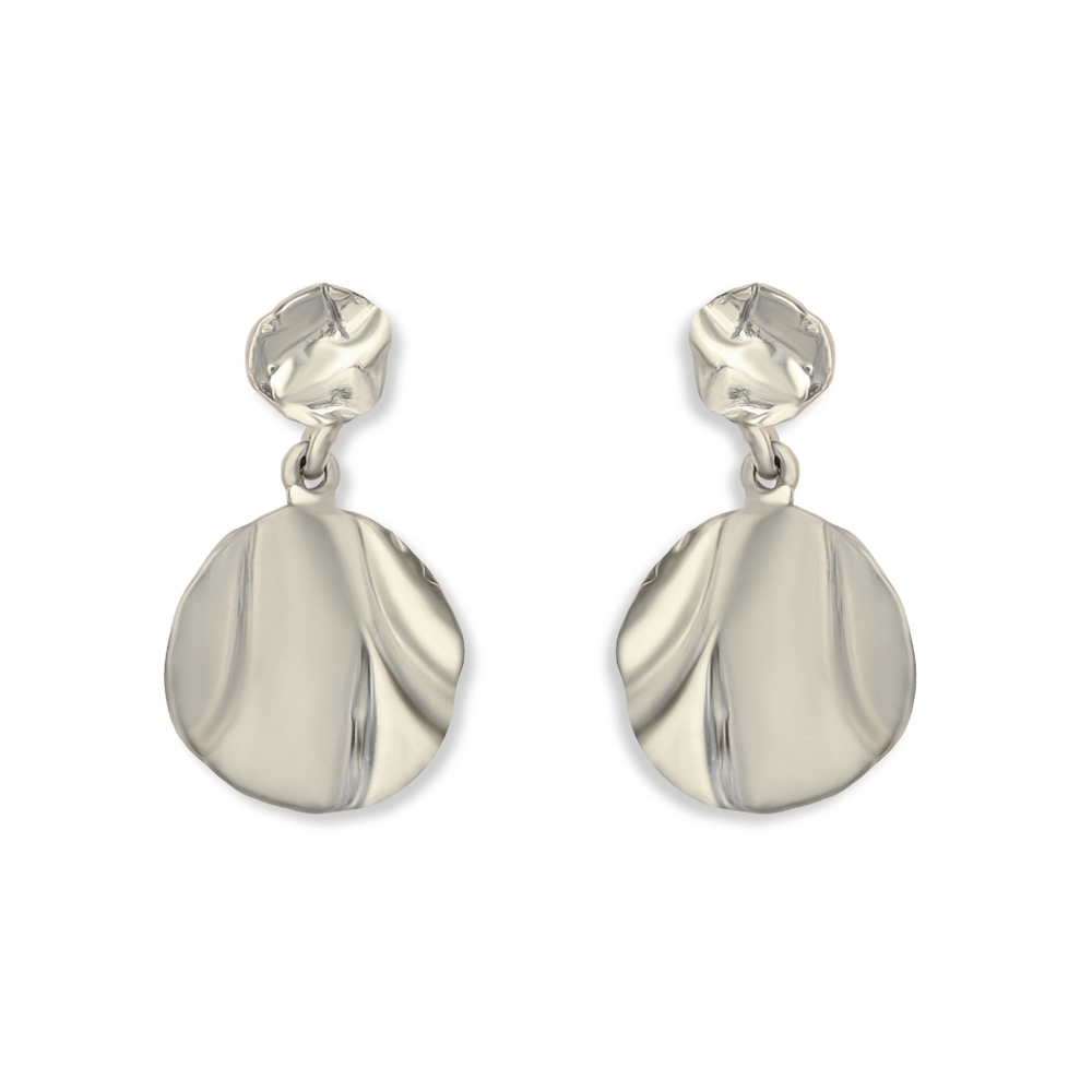 The Tide Drop Earrings by Madeleine Sculptural Jewellery feature silver, abstract-shaped drops with wavy textures, circular studs, and large oval pendants—an elegant piece of handmade jewellery.