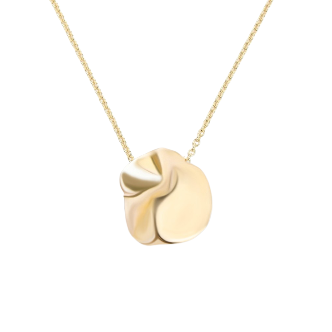 Discover the Tide Necklace by Madeleine Sculptural Jewellery—a gold pendant with an abstract, crumpled design, hand-carved for unique detail and sustainability. It hangs on a fine gold chain against a white background.