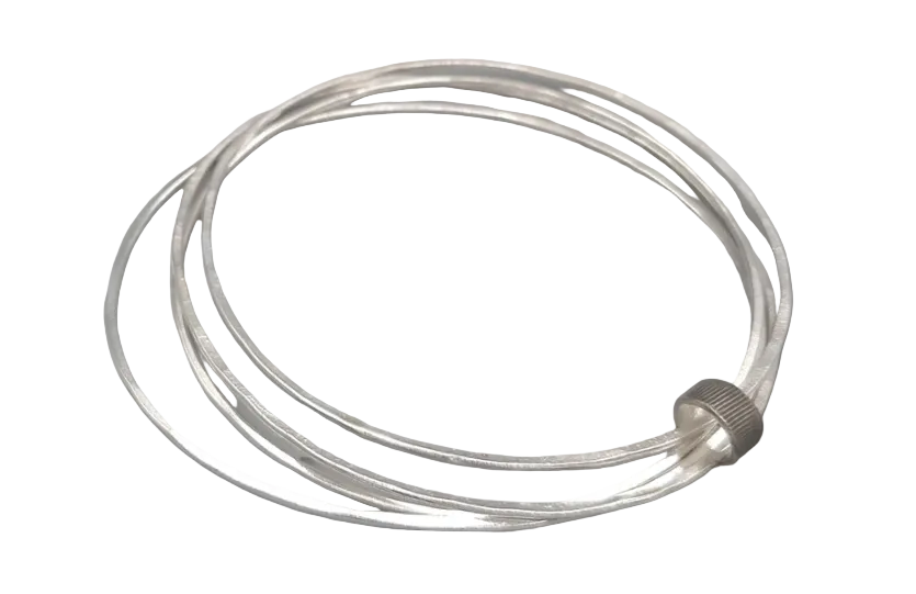 A silver-toned multi-strand bangle bracelet with a textured screw-top closure, shown on a neutral light gray background.